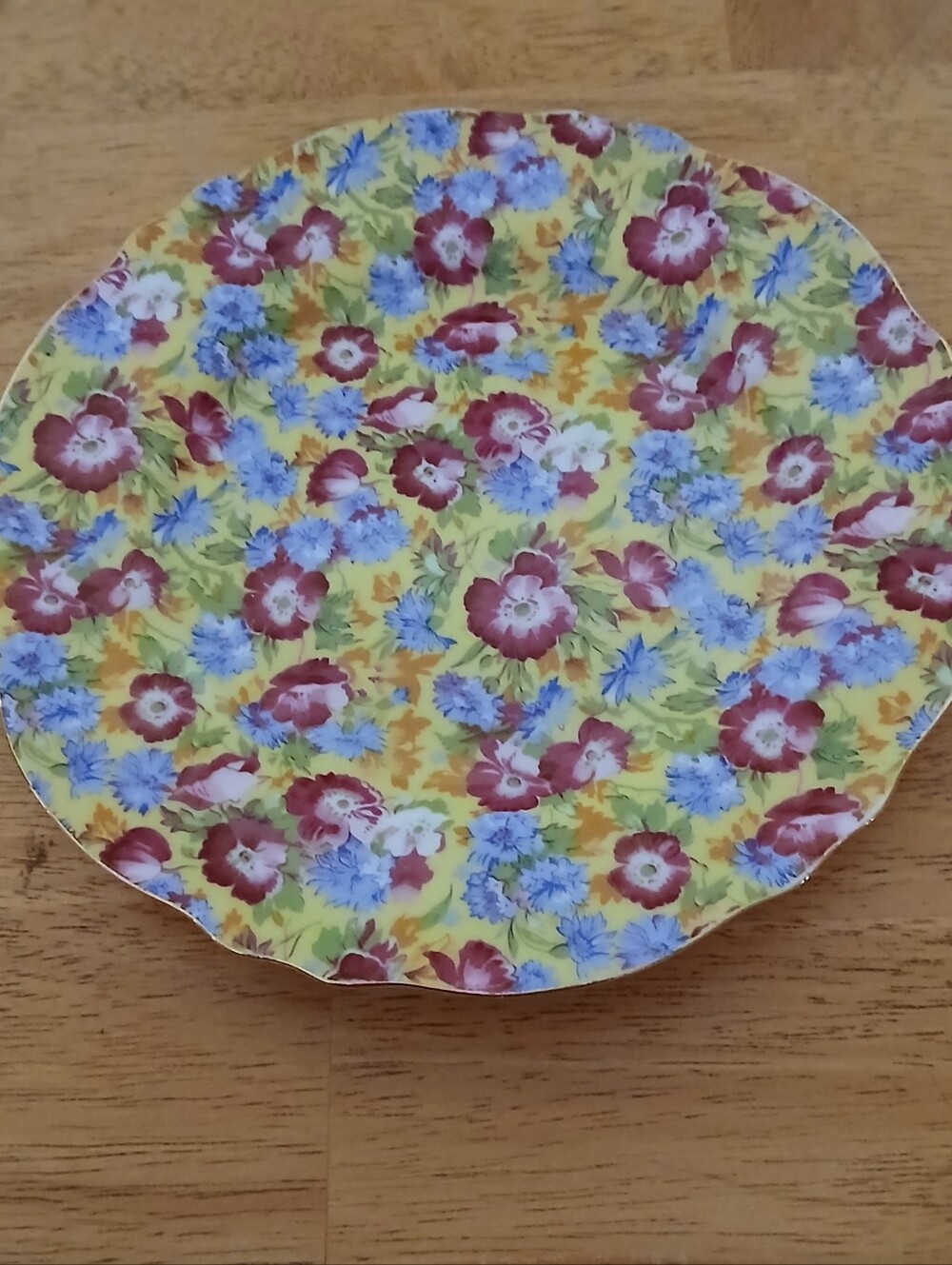 Two's Company Yellow Floral Disposable Party Plate with Red and Blue Blooms
